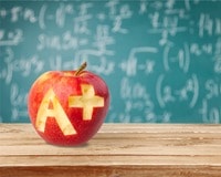 Apple with A+ carved into it